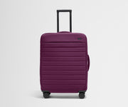 Front product view of The Softside Medium suitcase in Plum Purple with raised handle