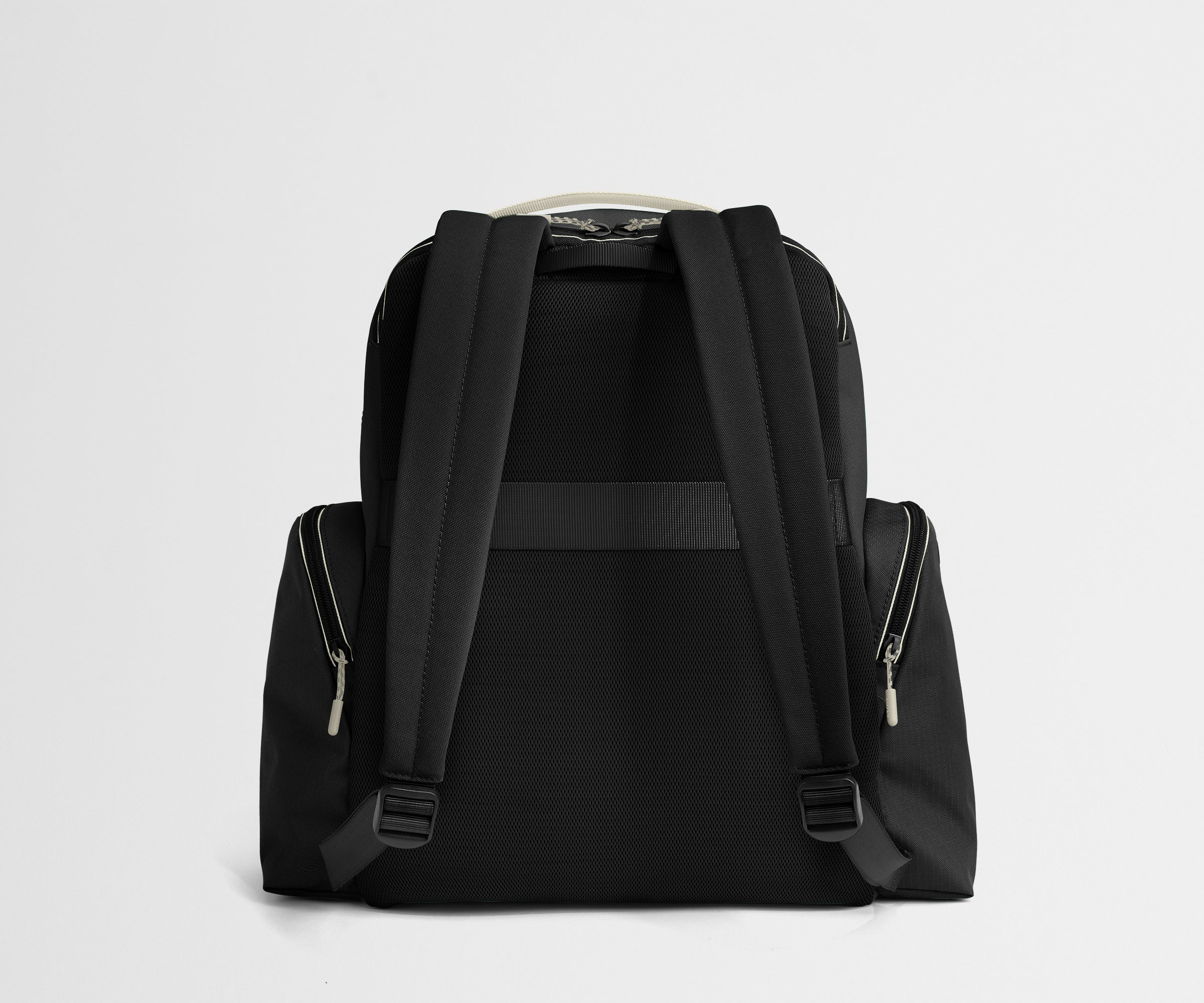 Black backpack on a light gray background