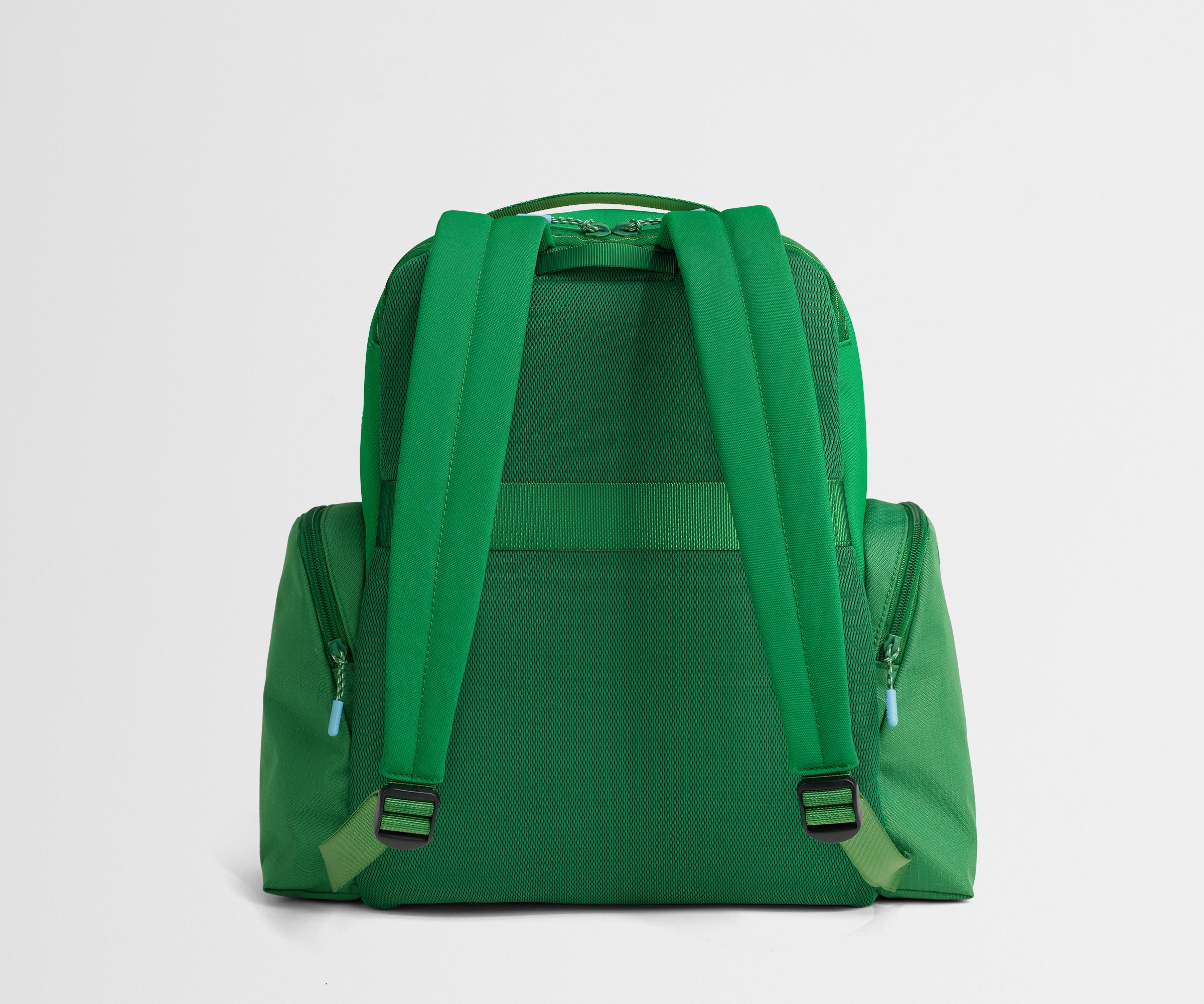 Green backpack on a light gray background