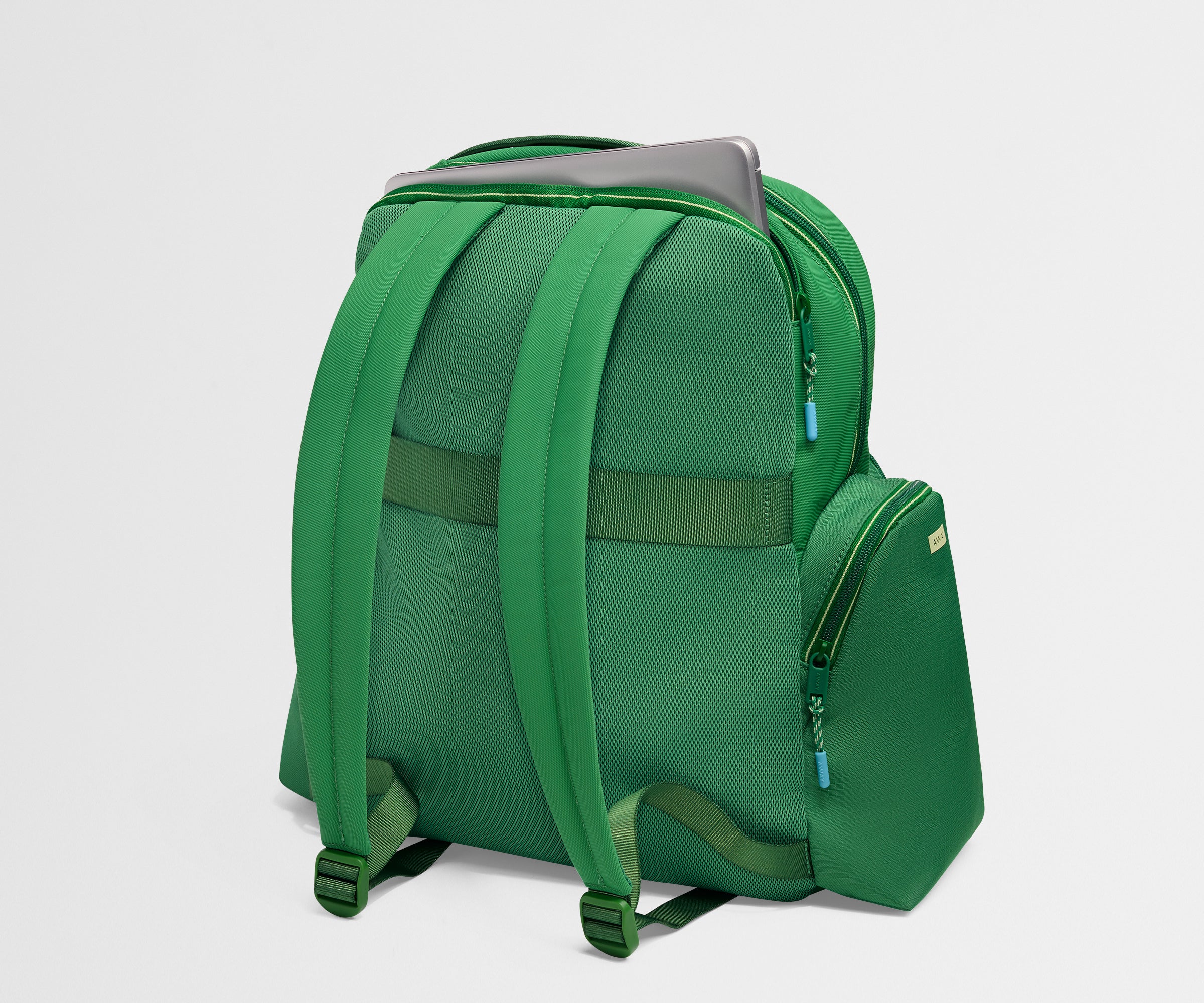 Green backpack on a light gray background