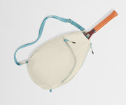 Beige racket bag with blue strap and orange handle on a light gray background