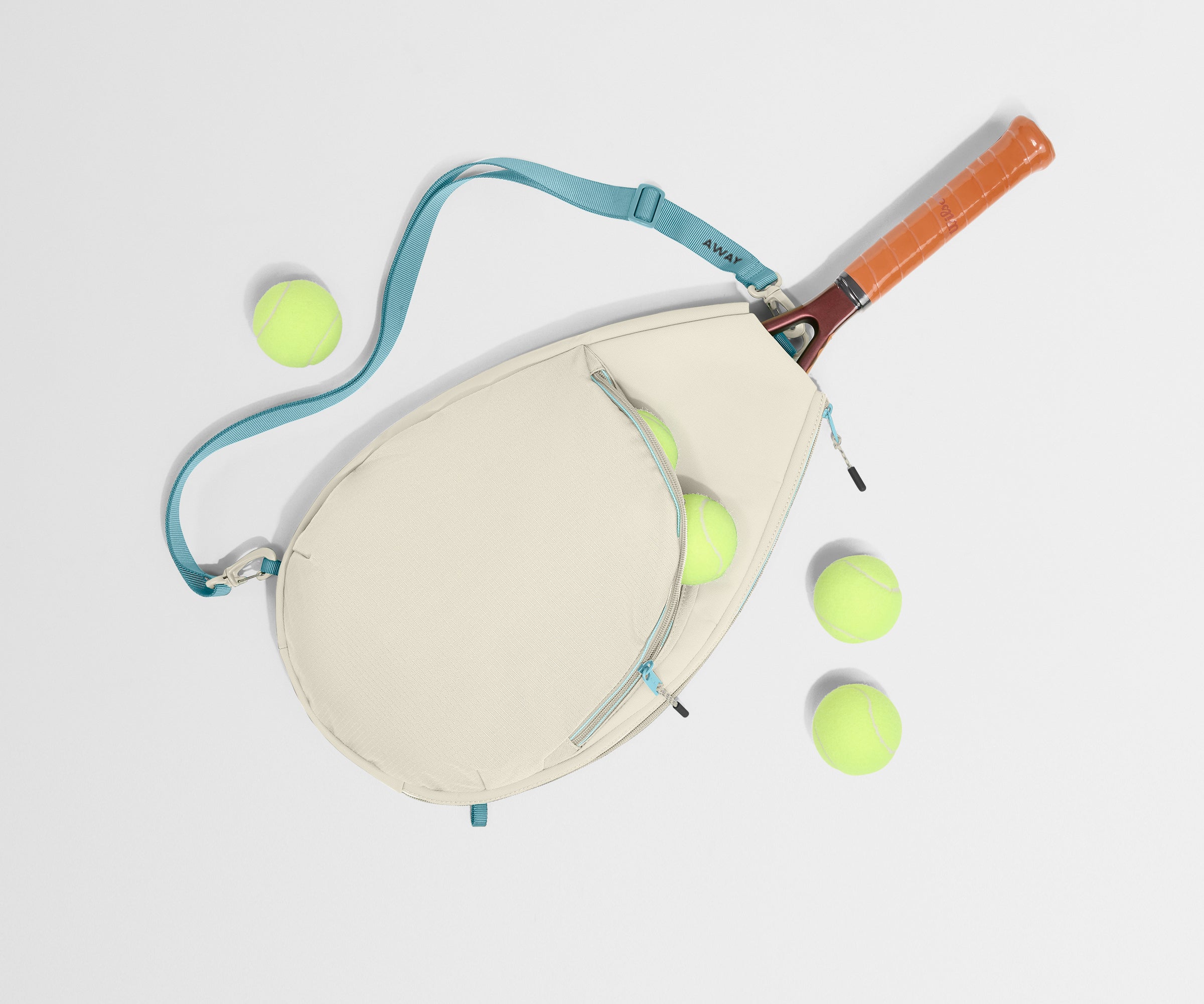 Paddle and tennis balls on a light gray background