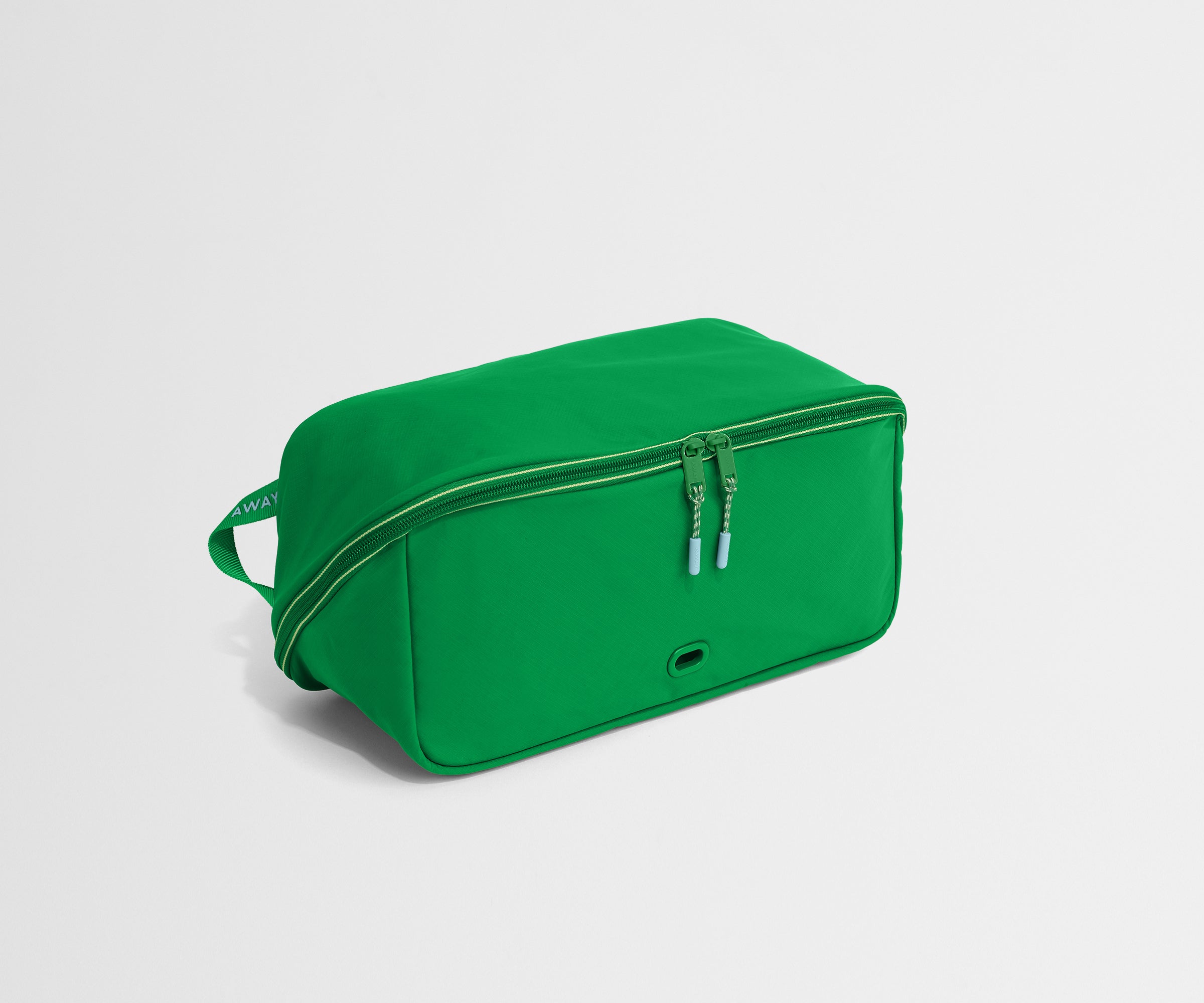 Green shoe bag on a light gray background