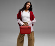 Person carrying the Train Case by its top handle