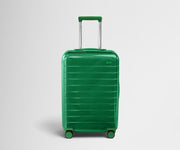 Front product view of The Bigger Carry-On suitcase in Translucent Green