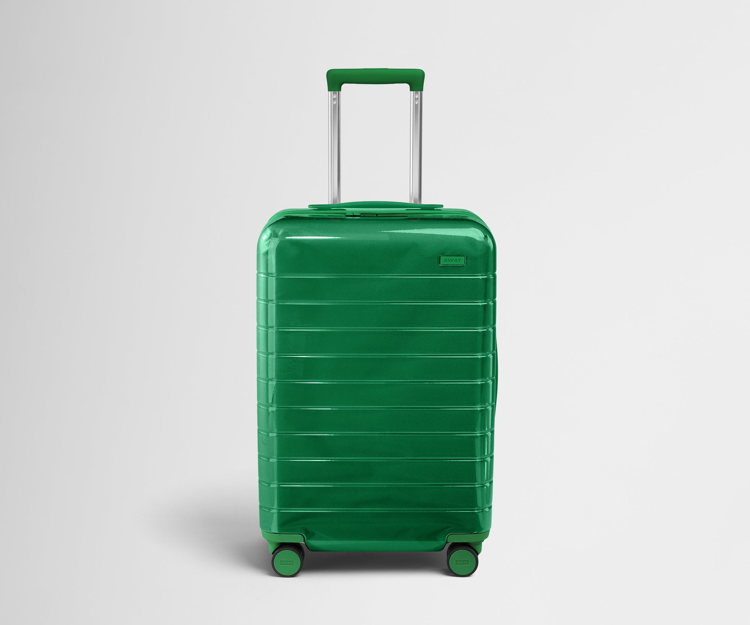 Front product view of The Bigger Carry-On suitcase in Translucent Green