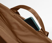 Phone shown in the hidden pocket between handles