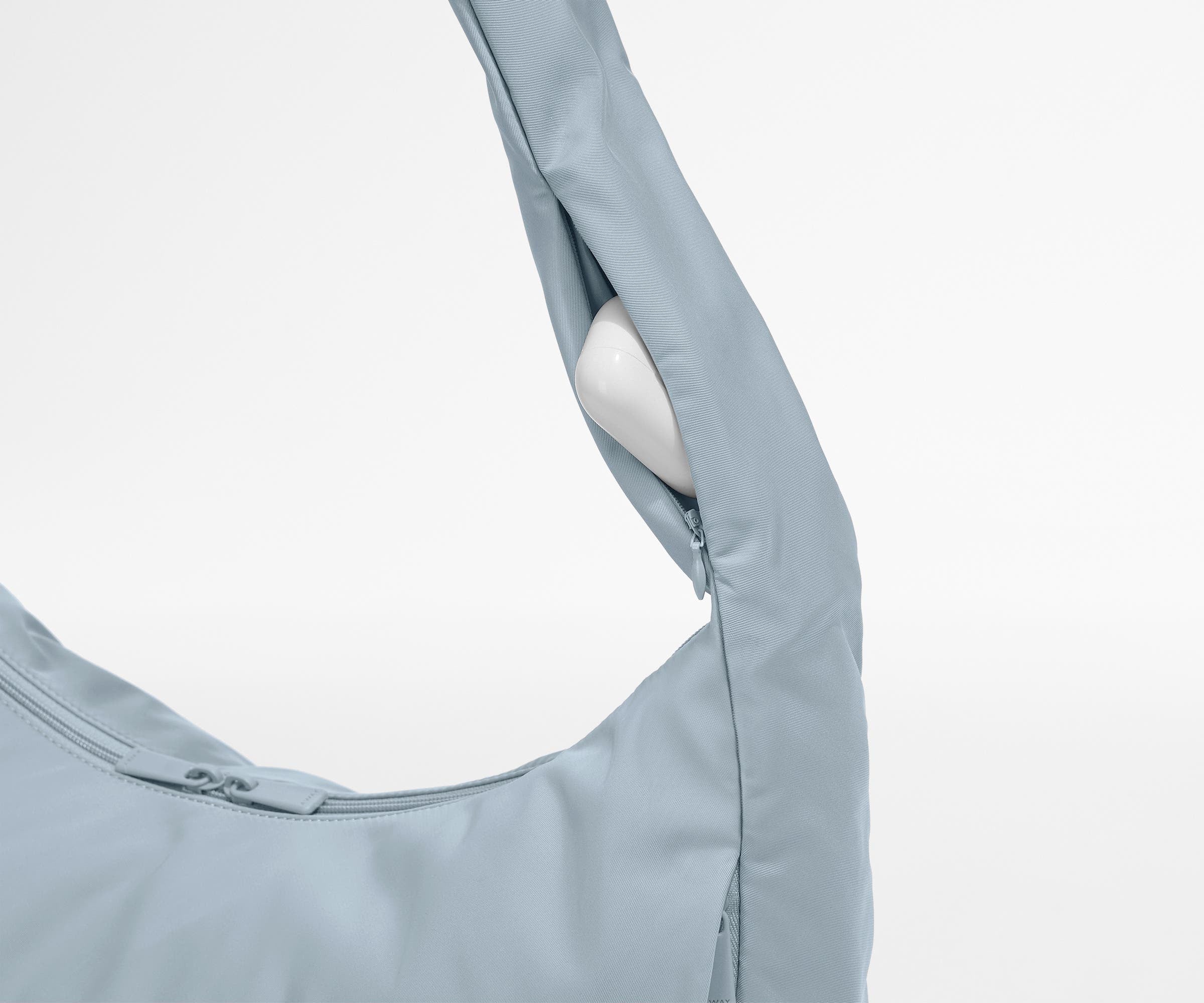 Earpods case packed in the discreet, zippered strap pocket