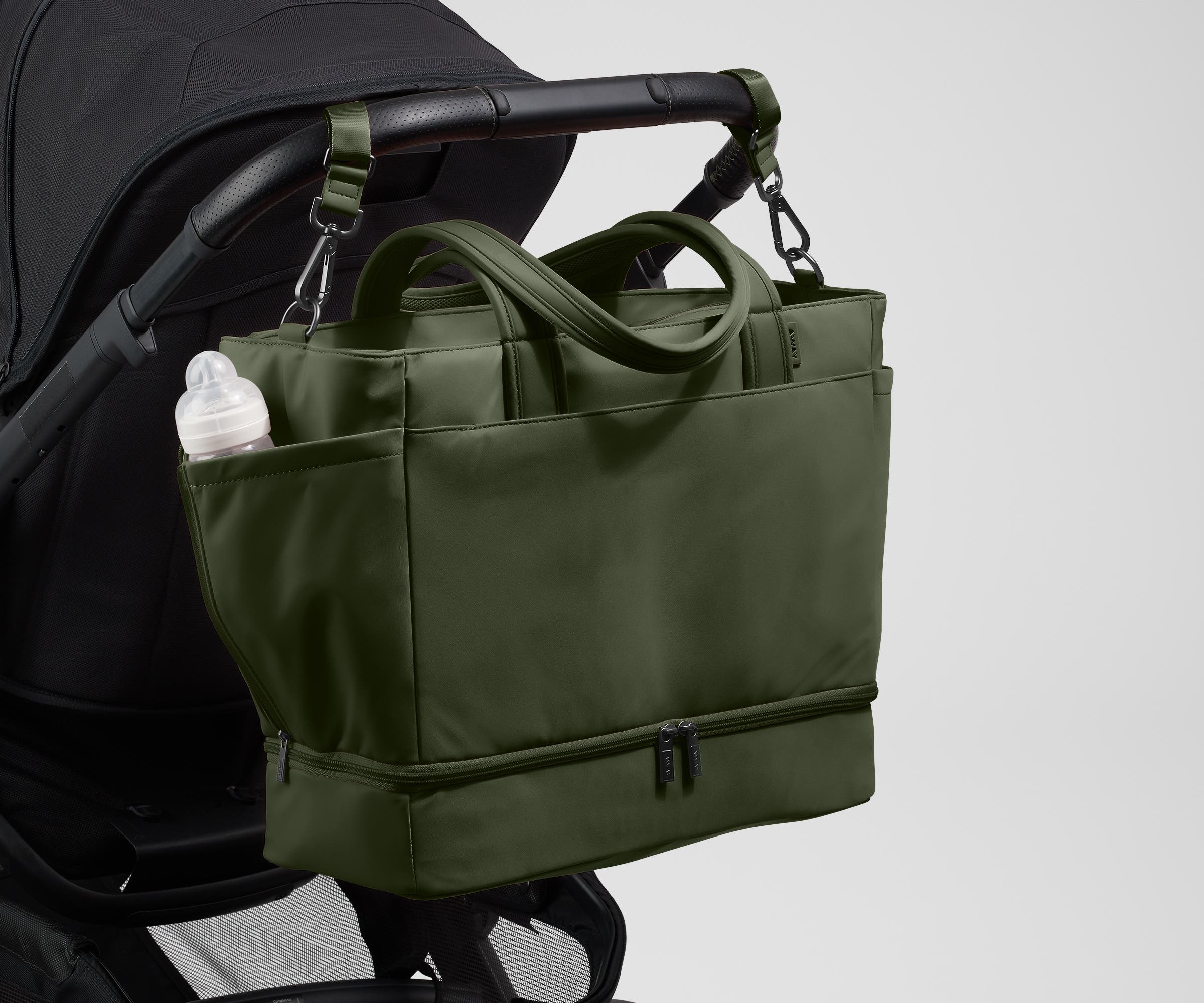 Tote attached to a stroller using the included stroller clips