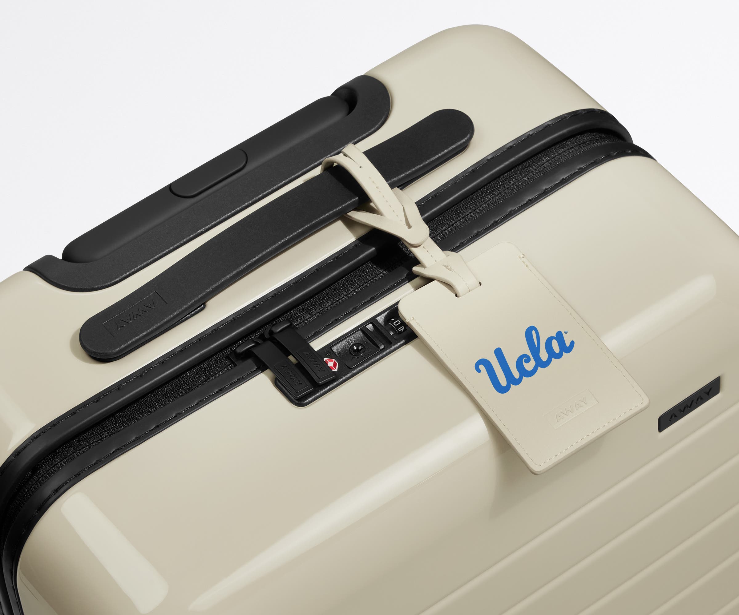 UCLA ® Collegiate Luggage Tag on top of a matching UCLA ® Collegiate Bigger Carry-On suitcase