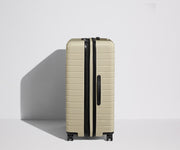 Side product view of The Large Flex suitcase shown fully expanded