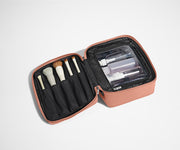 Cosmetics Bag packed with make up brushes and skincare