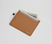Card case filled with money and credit cards