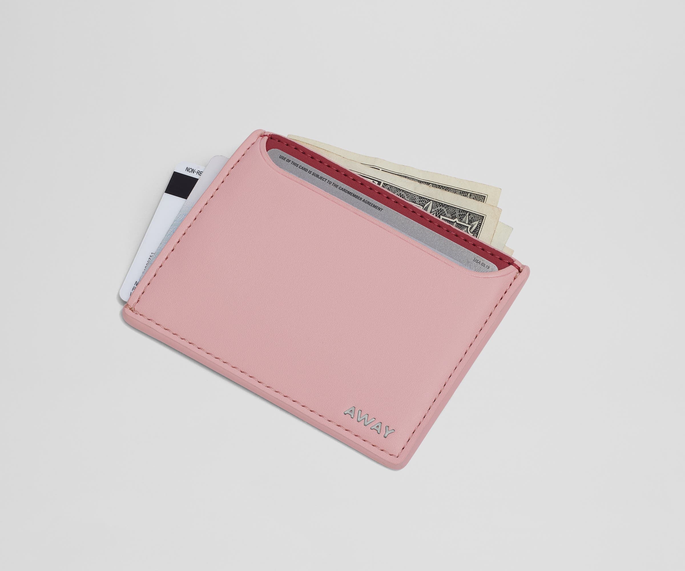 Card case filled with money and credit cards