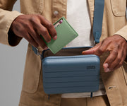 Card case being packed inside The Mini Crossbody