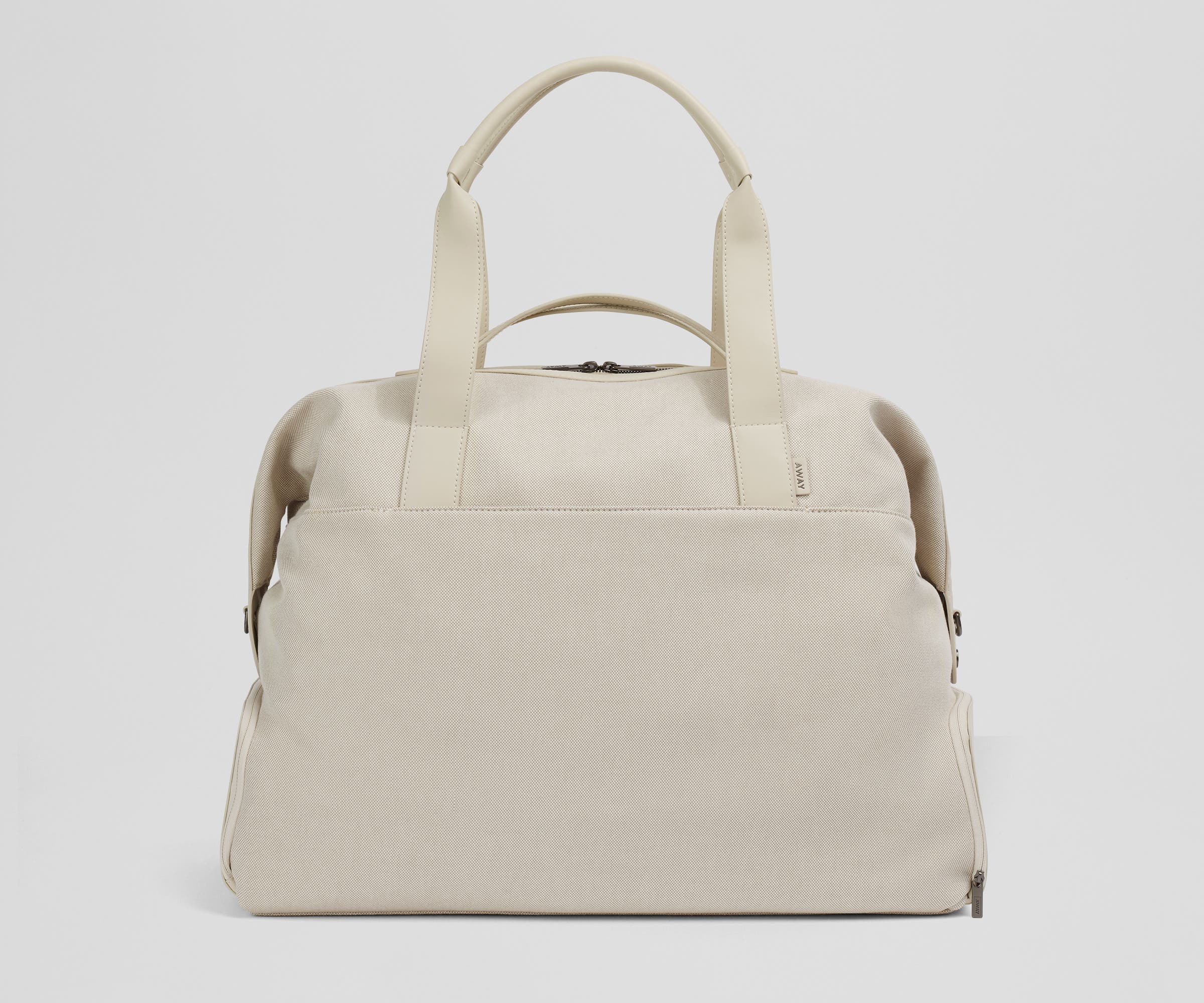 Front view of the Transit Canavs Weekender with its leather handles up