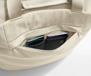 Phone and passport packed in an exterior zip pocket