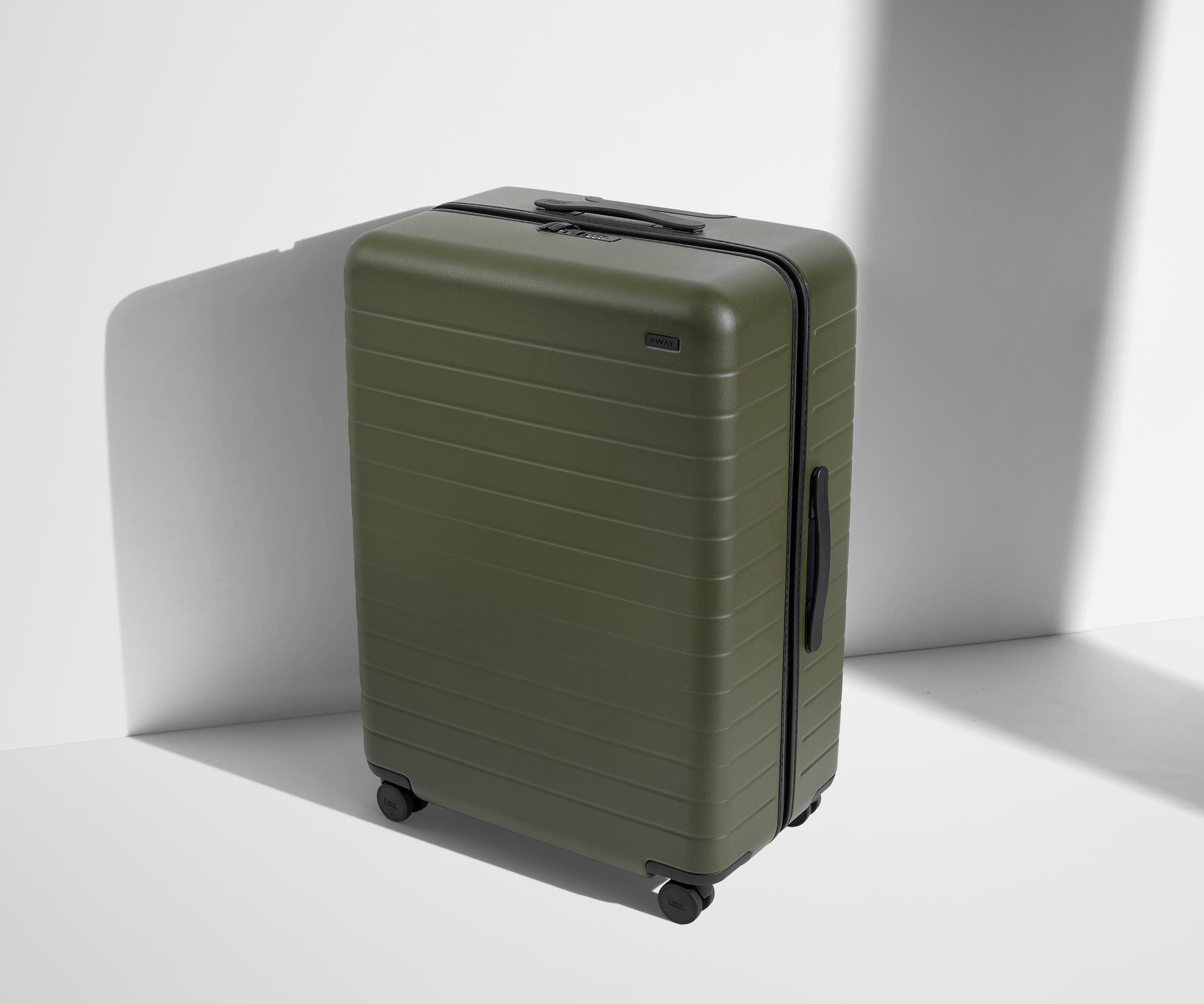 Angled product view of The Large suitcase in Olive Green
