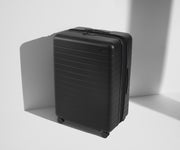 Angled product view of The Large Flex suitcase in Jet Black