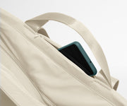 Phone shown in the hidden pocket between handles