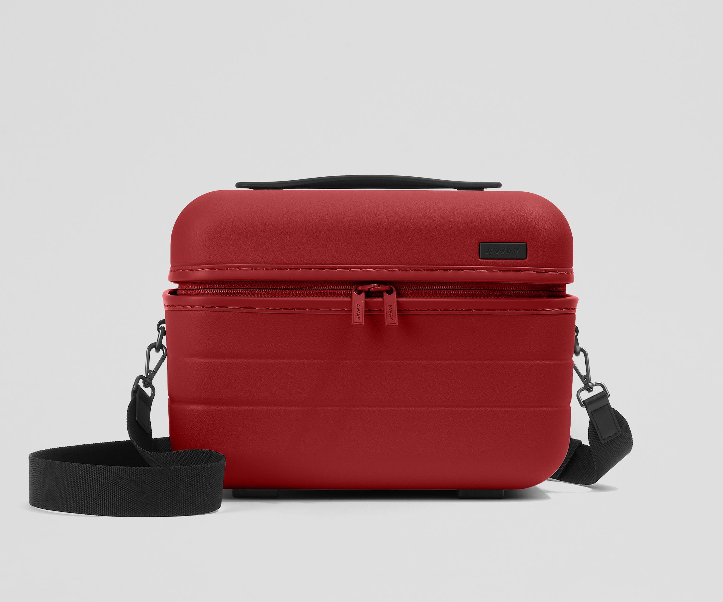 Front view of the Train Case with a detachable shoulder strap