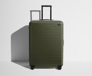 Front product view of The Large suitcase in Olive Green with raised handle