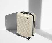 Angled product view of The Bigger Carry-On suitcase in Salt White (Gloss)