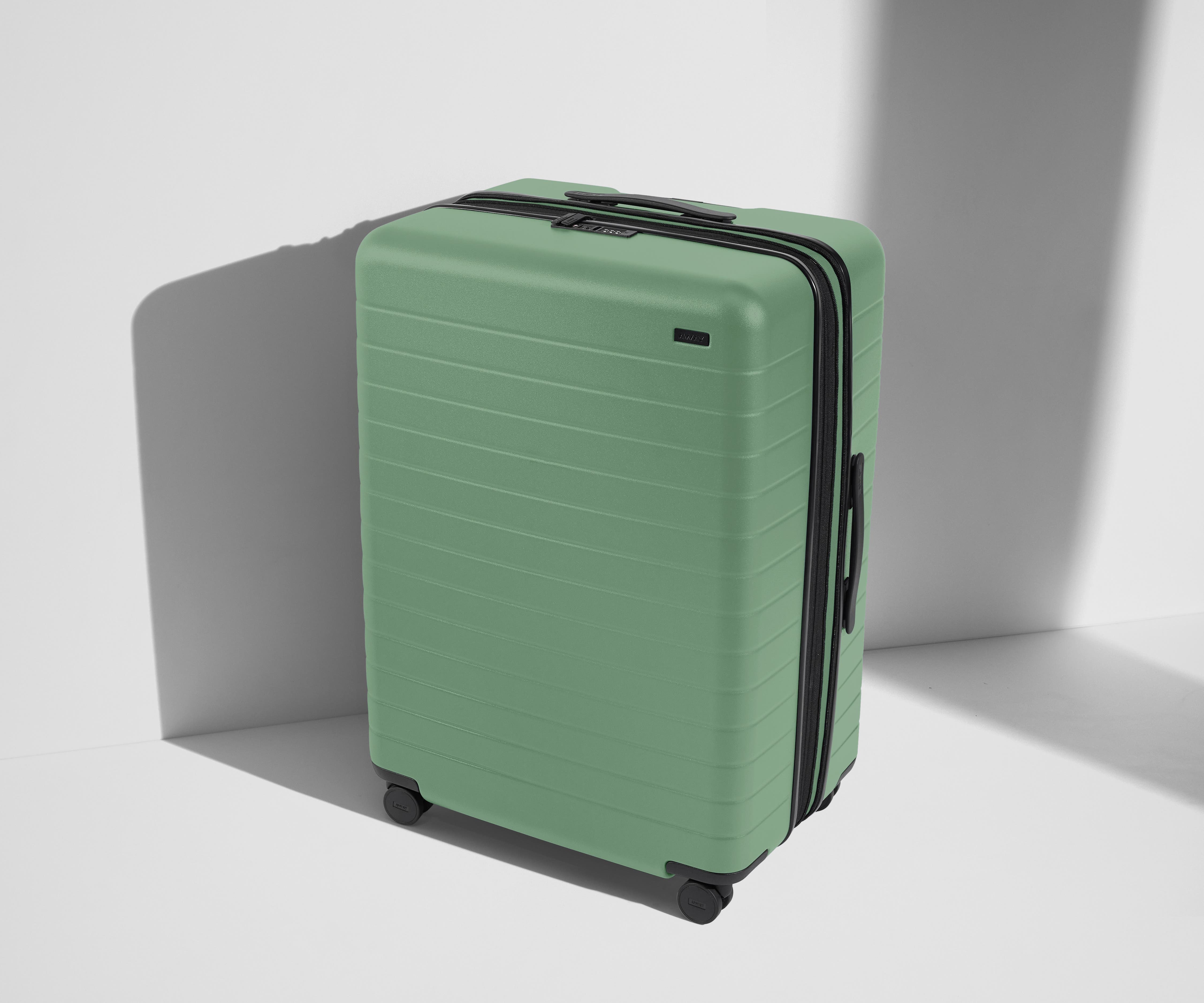 Angled product view of The Large Flex suitcase in Sea Green