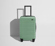 Front product view of The Carry-On Flex suitcase in Sea Green with raised handle