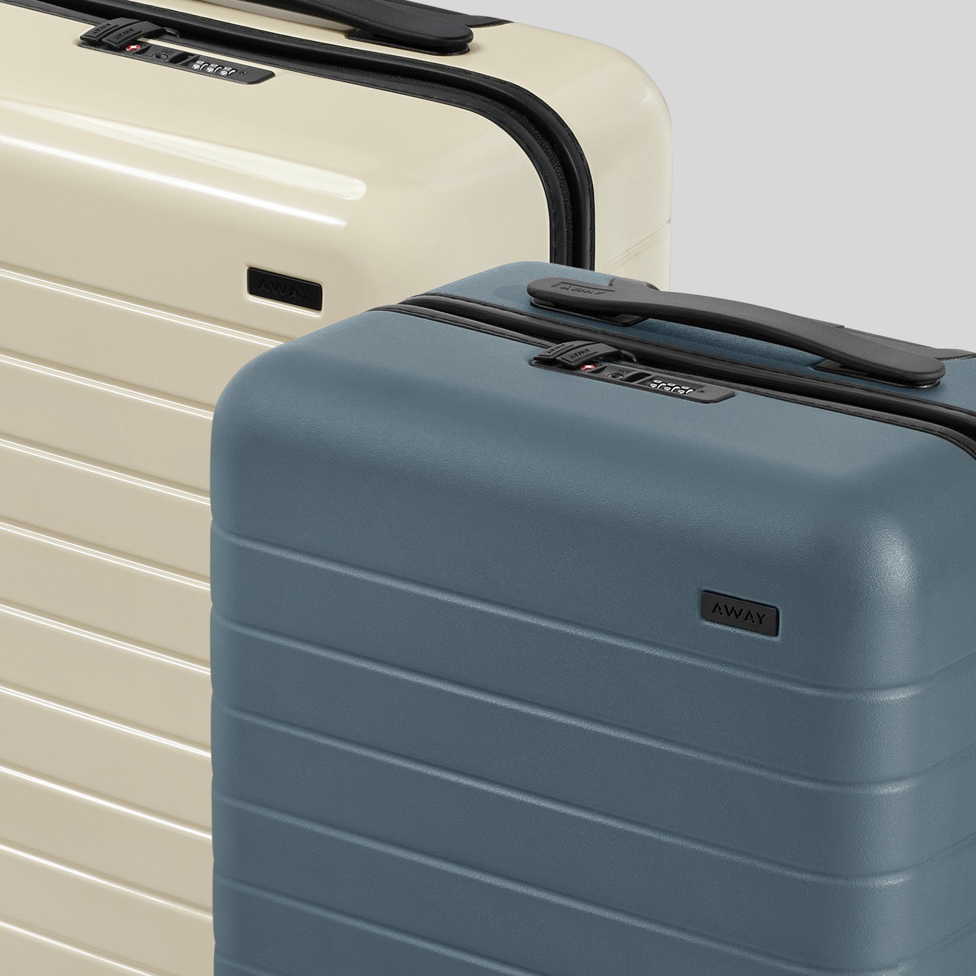 Close up shot of two Away Carry-on suitcases in coast blue salt gloss white