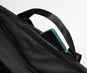 Phone shown in the hidden pocket between handles