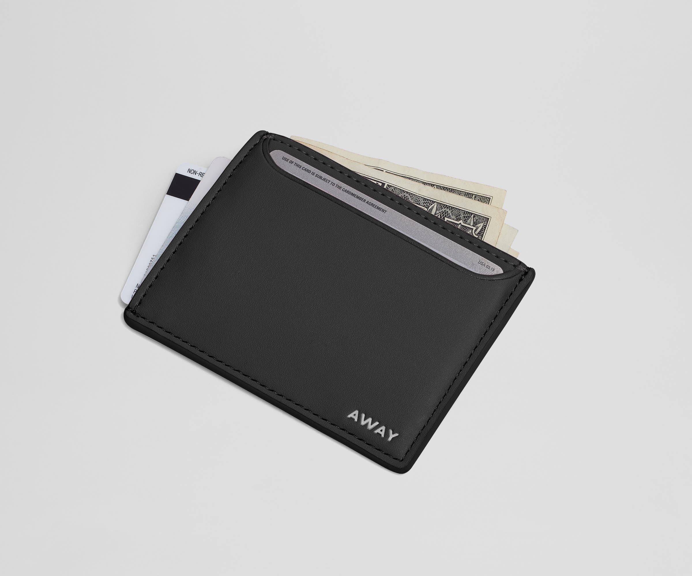 Card case filled with money and credit cards