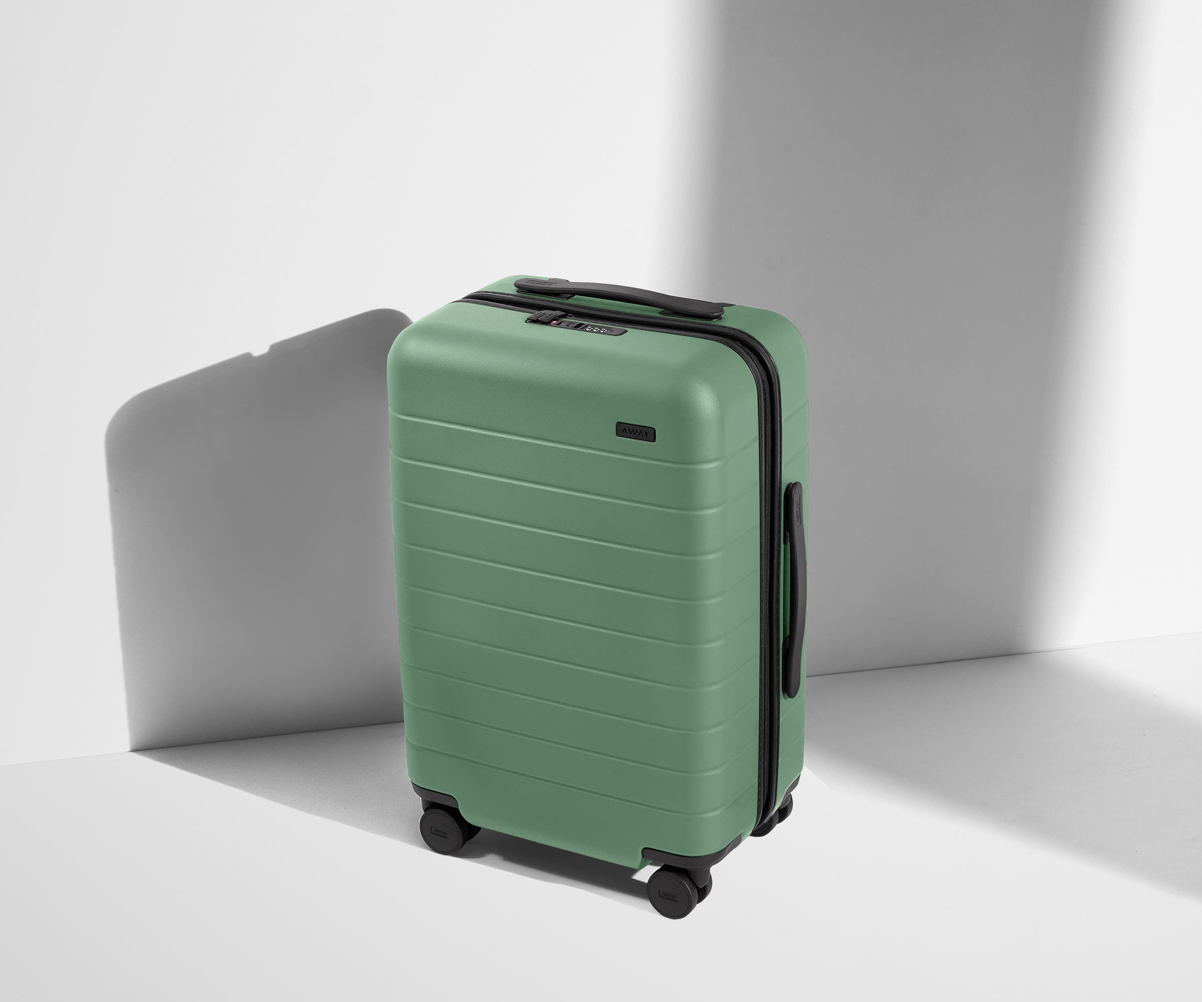 Angled product view of The Carry-On suitcase in Sea Green
