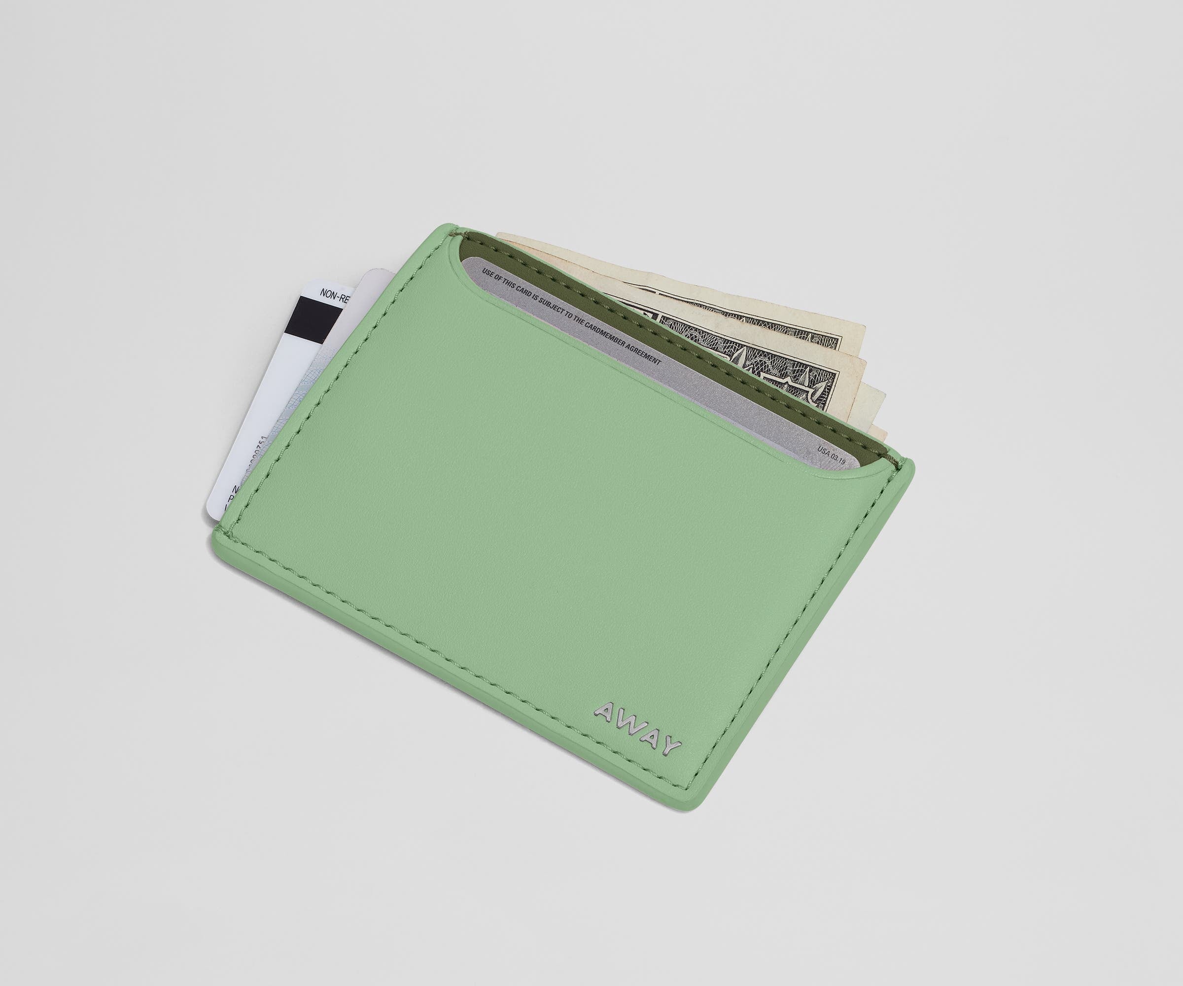 Card case filled with money and credit cards