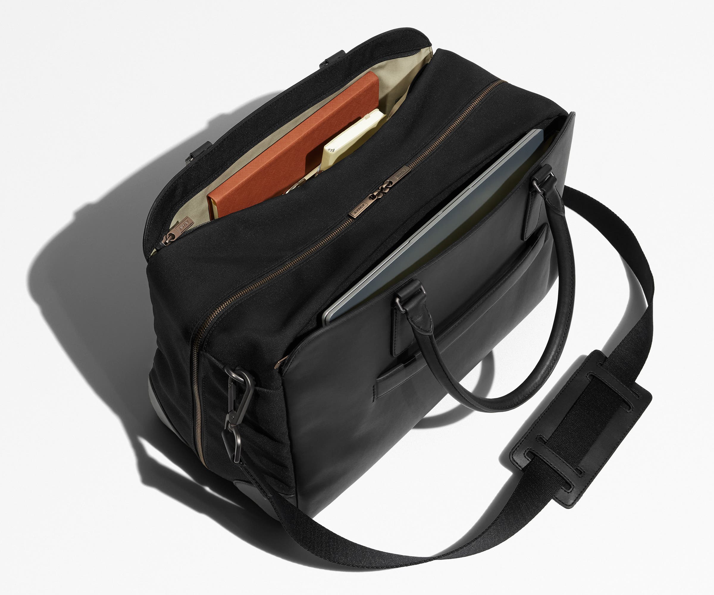 Two exterior slip pockets packed with a laptop and notebooks