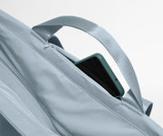 Phone shown in the hidden pocket between handles