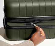 Hand unzipping the additional wraparound expansion feature