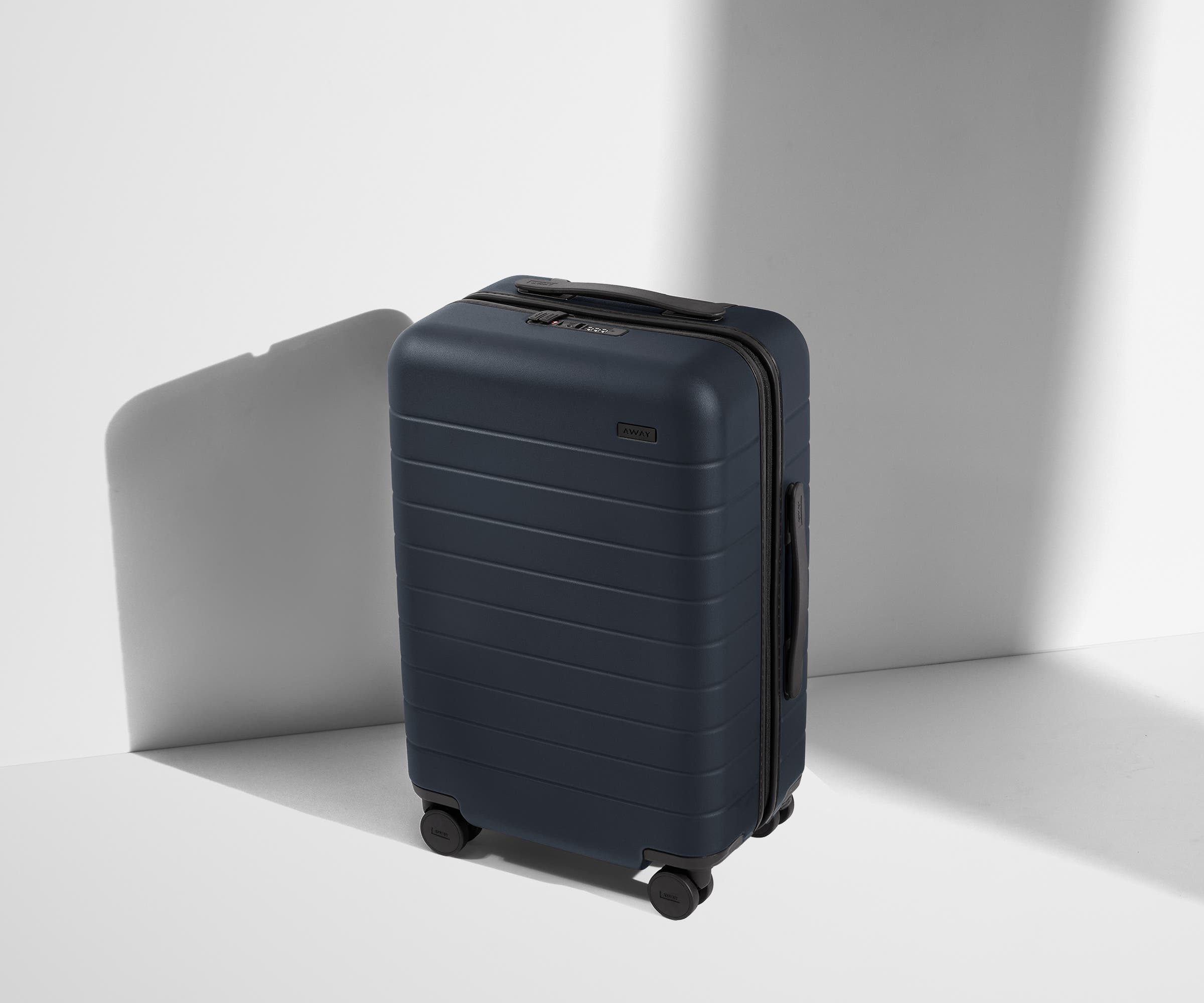 Angled product view of The Carry-On suitcase in Navy Blue