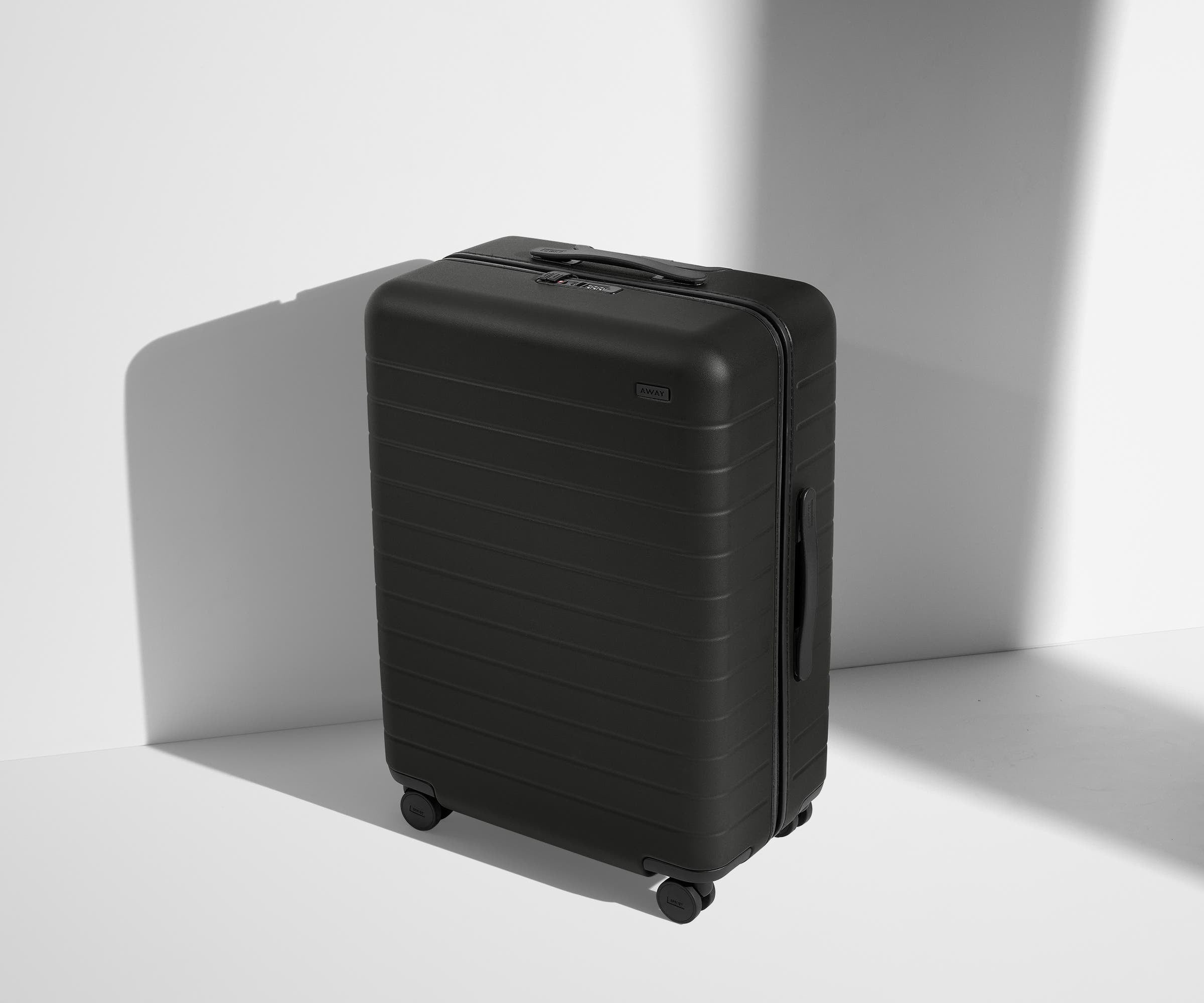 Angled product view of The Medium suitcase in Jet Black