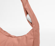Earpods case packed in the discreet, zippered strap pocket