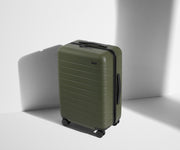Angled product view of The Bigger Carry-On suitcase in Olive Green