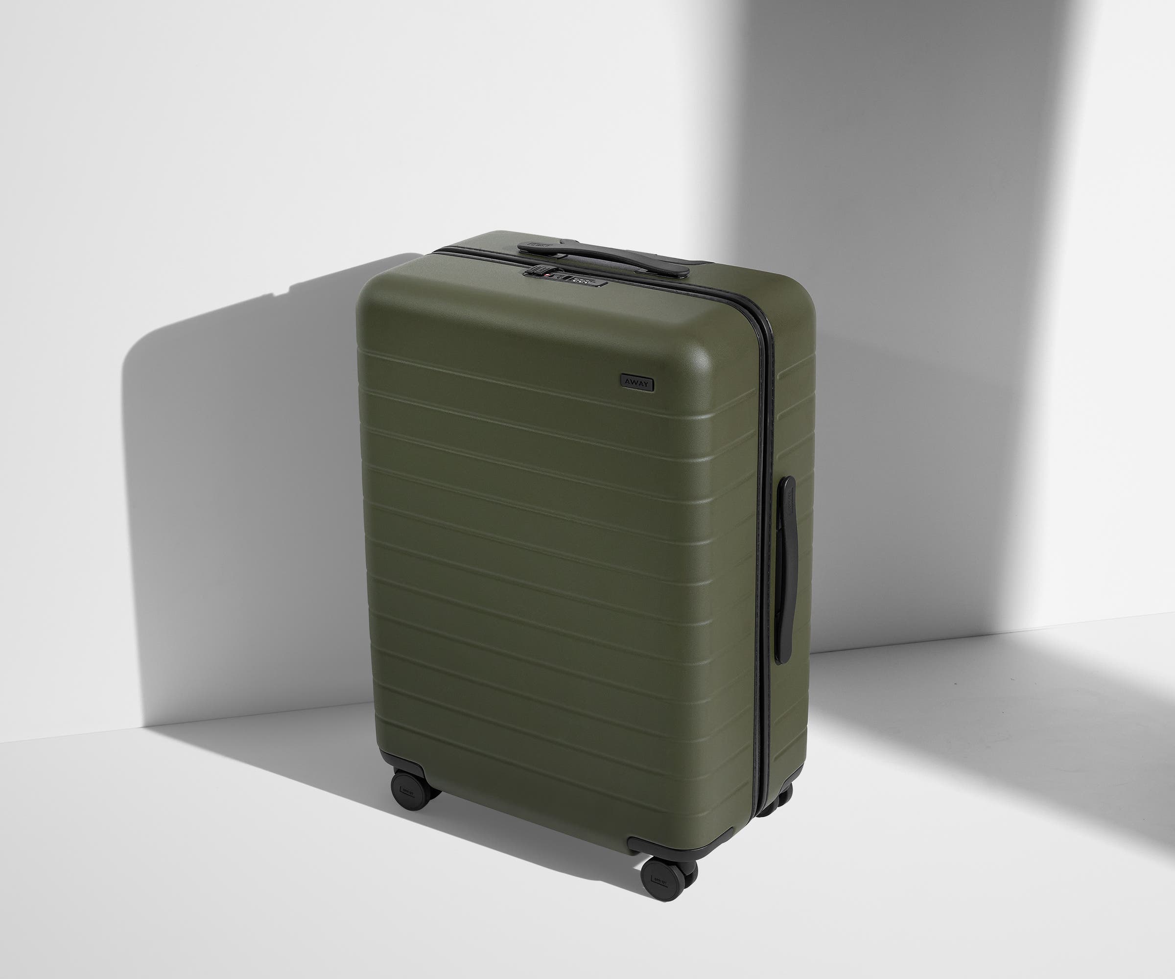 Angled product view of The Medium suitcase in Olive Green