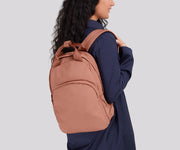 Person wearing the Featherlight Backpack on one shoulder