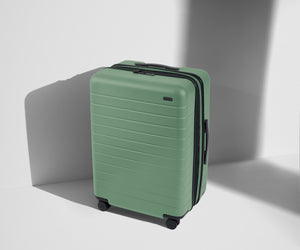 Angled product view of The Medium Flex suitcase in Sea Green