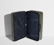 The Trunk suitcase in Olive Green shown open in an upright position to show interior organization and compression system