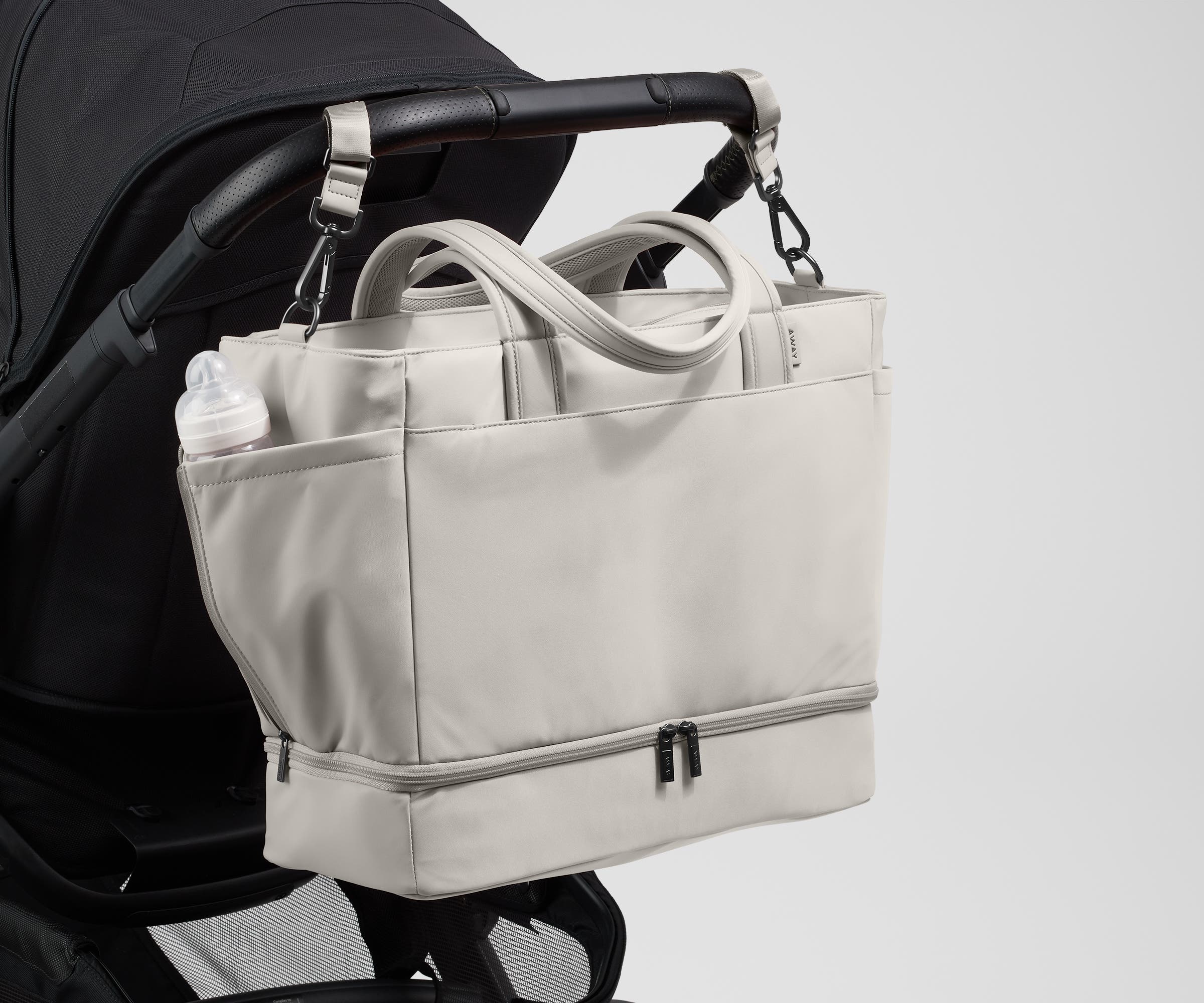 Tote attached to a stroller using the included stroller clips