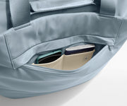 Phone and passport packed in an exterior zip pocket