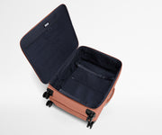 Open, unpacked Softside Large suitcase, showing the depth of the bag and signature compression pad feature