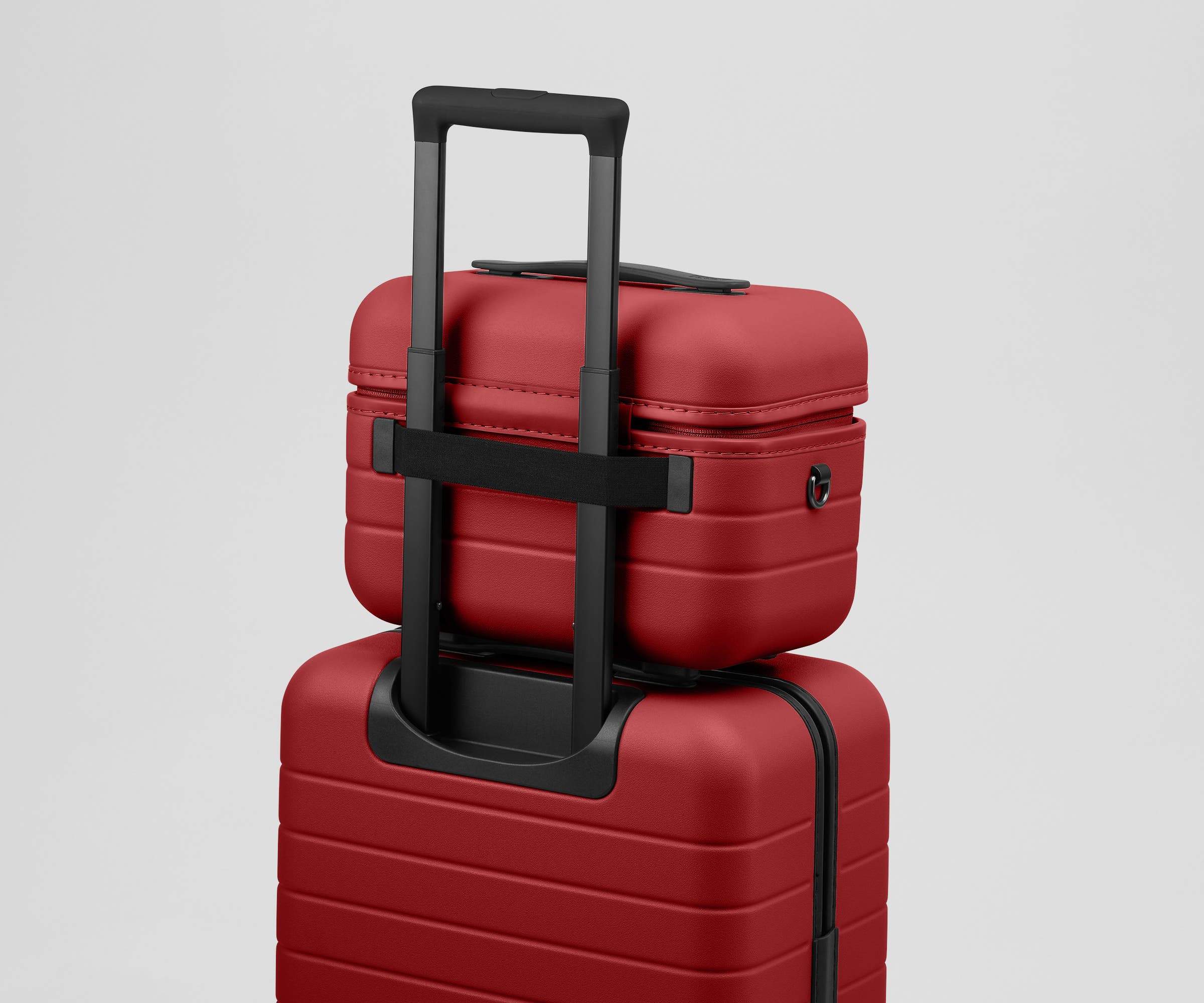 Train Case on top of an Away suitcase