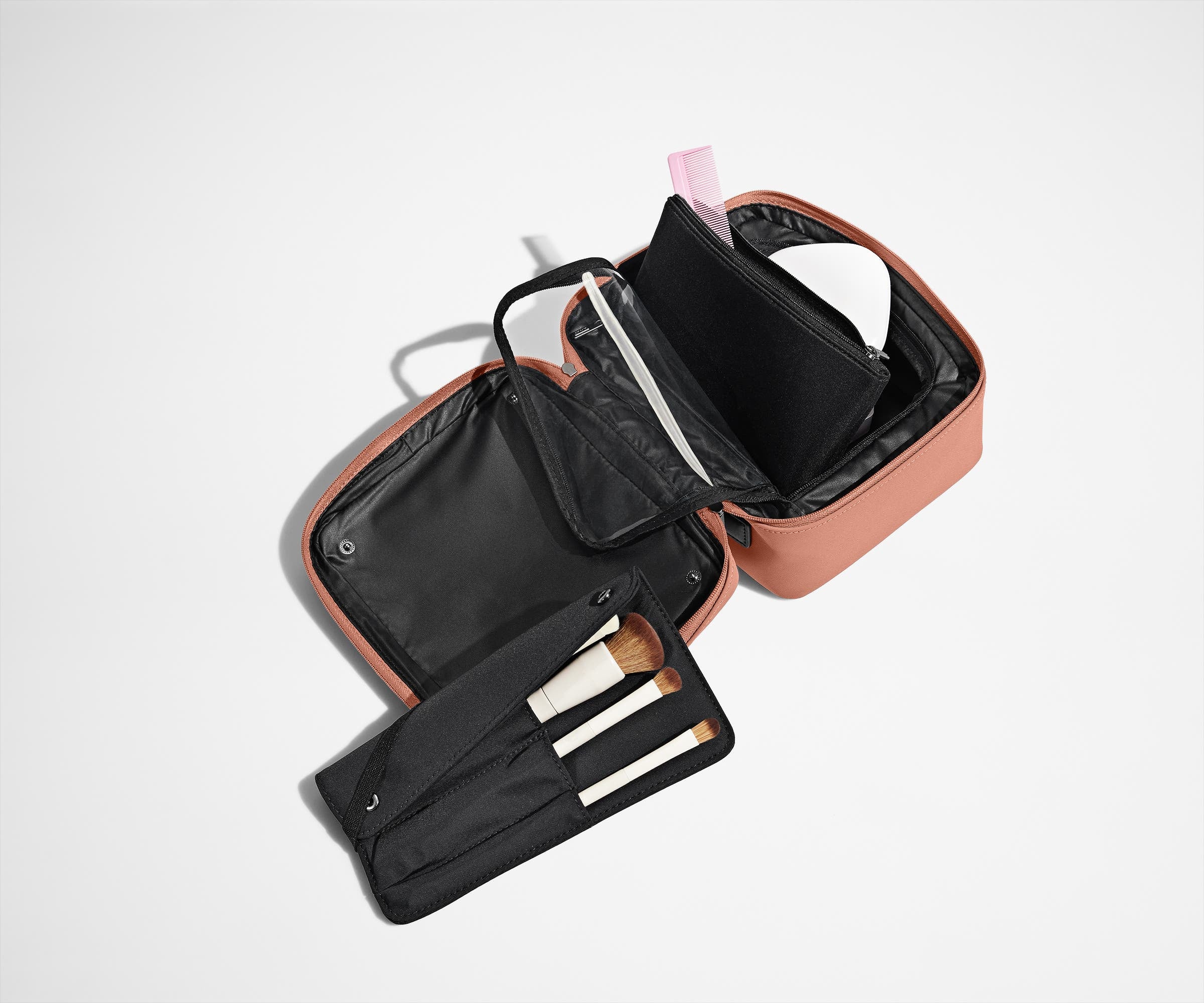 Cosmetics Bag packed with make up and shown with the detachable make up roll